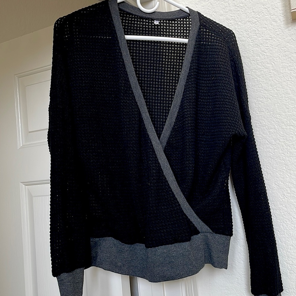 Black & grey color, fits loosely but still flattering.